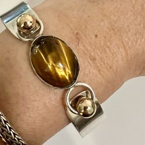 Elegant Silver and Gold Bracelet with a Tigers Eye Stone